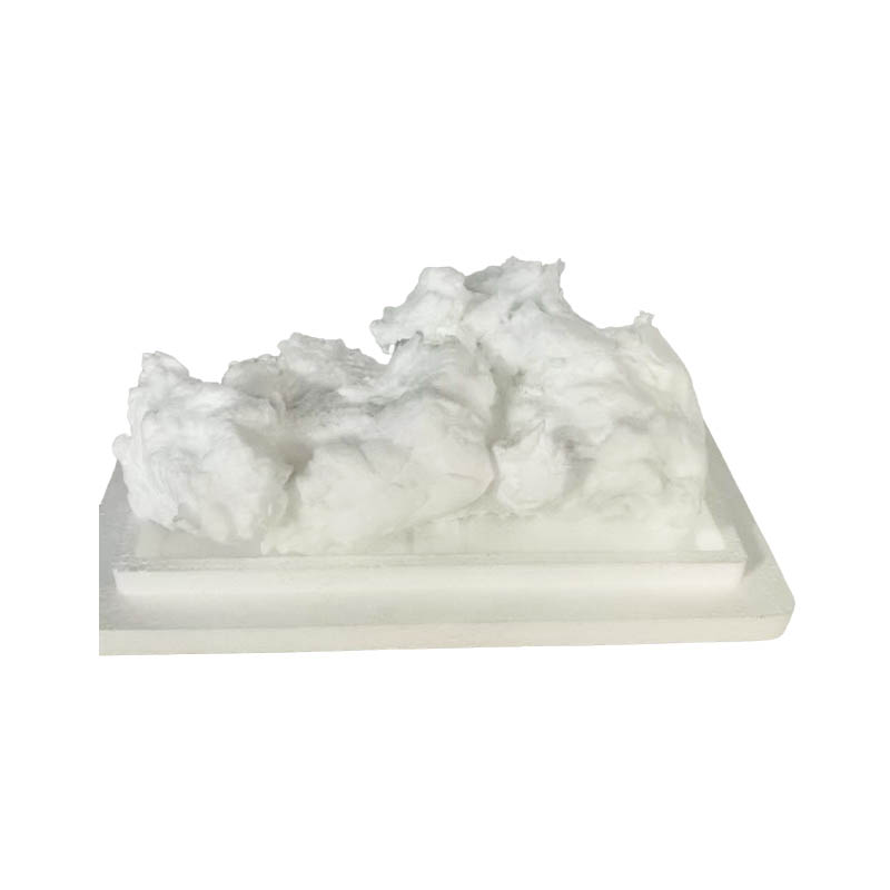 What is the mechanism by which humidity control in the production environment affects the brittleness of glass microfiber?