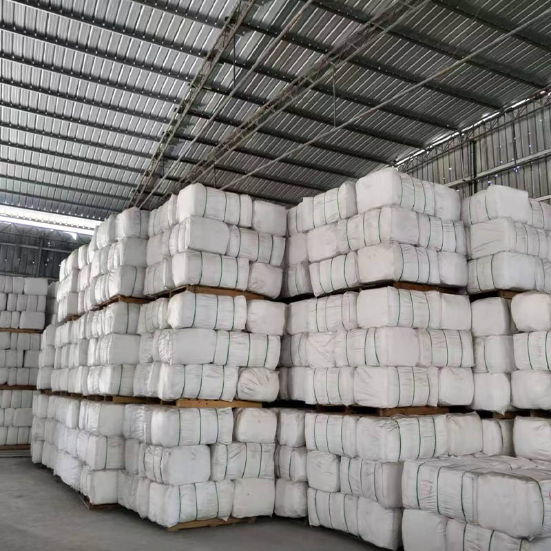 How does the uniform distribution of fibers in centrifugal glass microfiber paper contribute to its high dust-holding capacity?